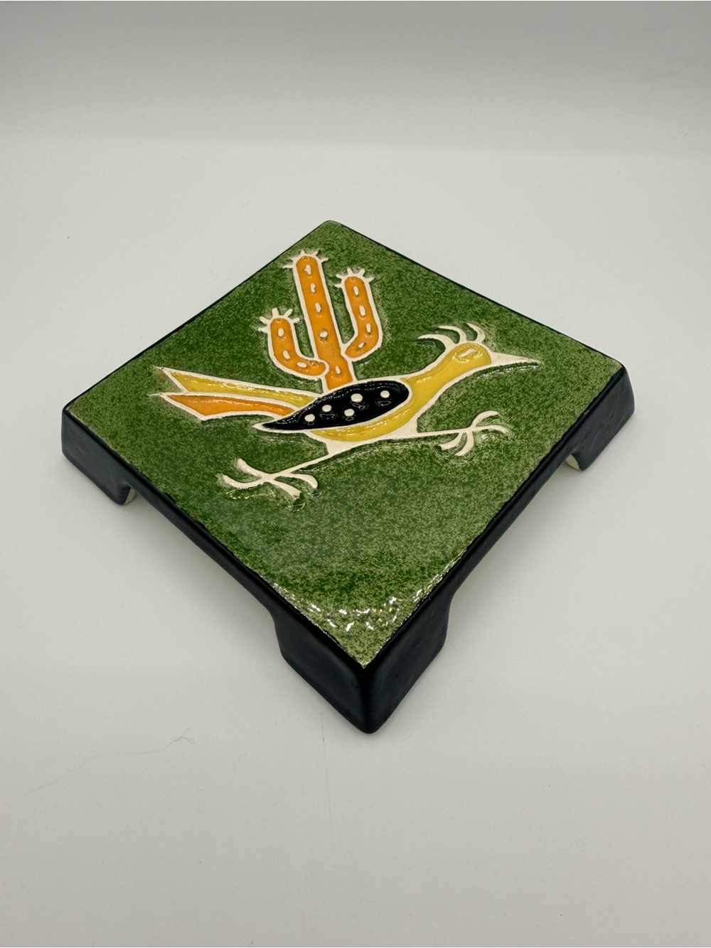 Vintage Legendware handcrafted ceramic roadrunner and cactus trivet.